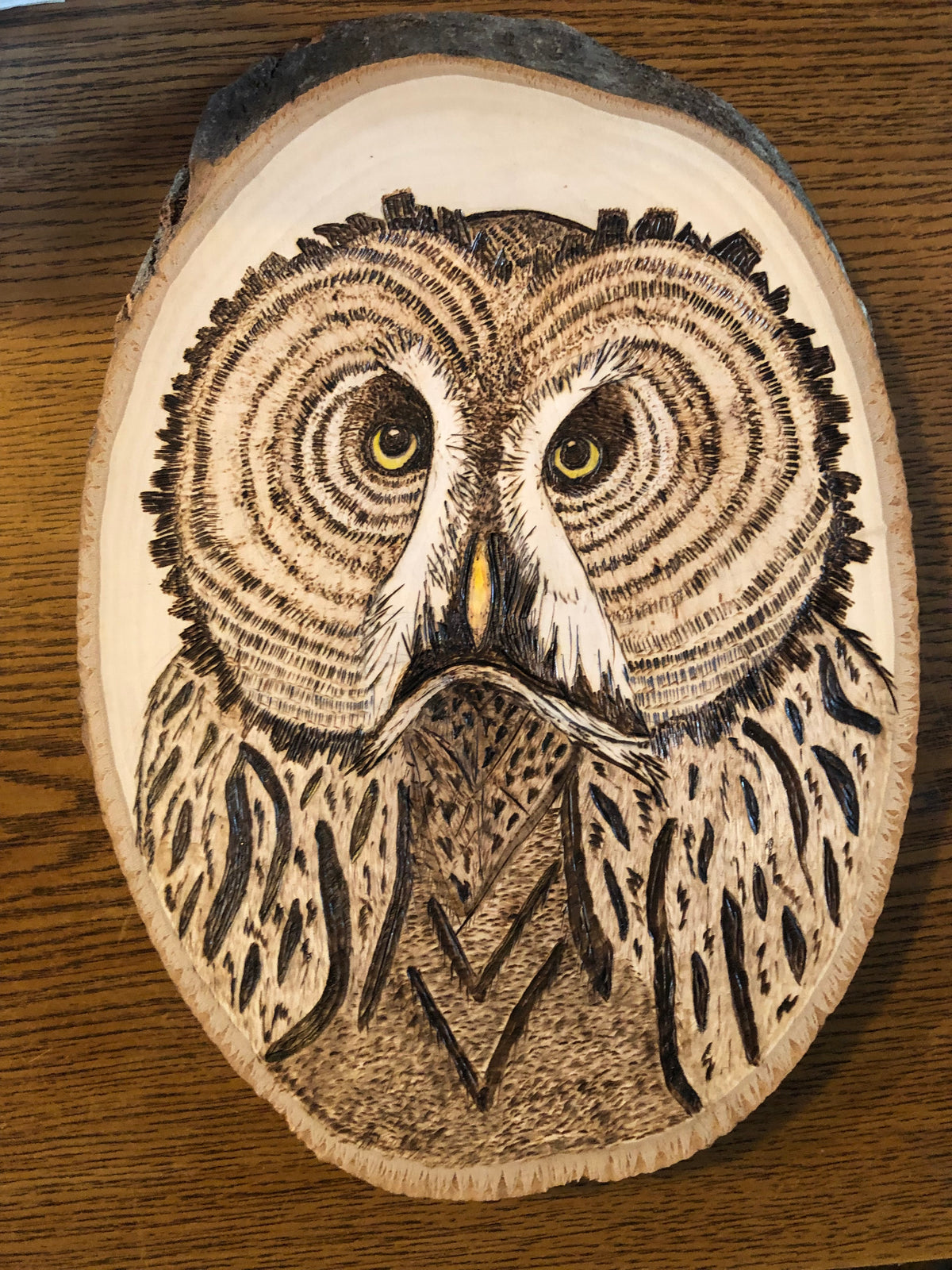 Wood-burned hand-drawn Alaskan animals and flora/fauna
