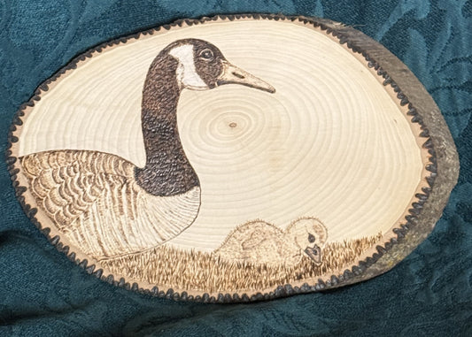 Wood-burned hand-drawn Alaskan animals and flora/fauna